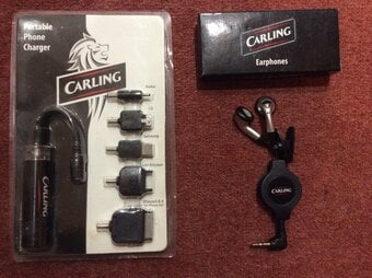 PORTABLE MOBILE PHONE CHARGER AND EARPHONES.