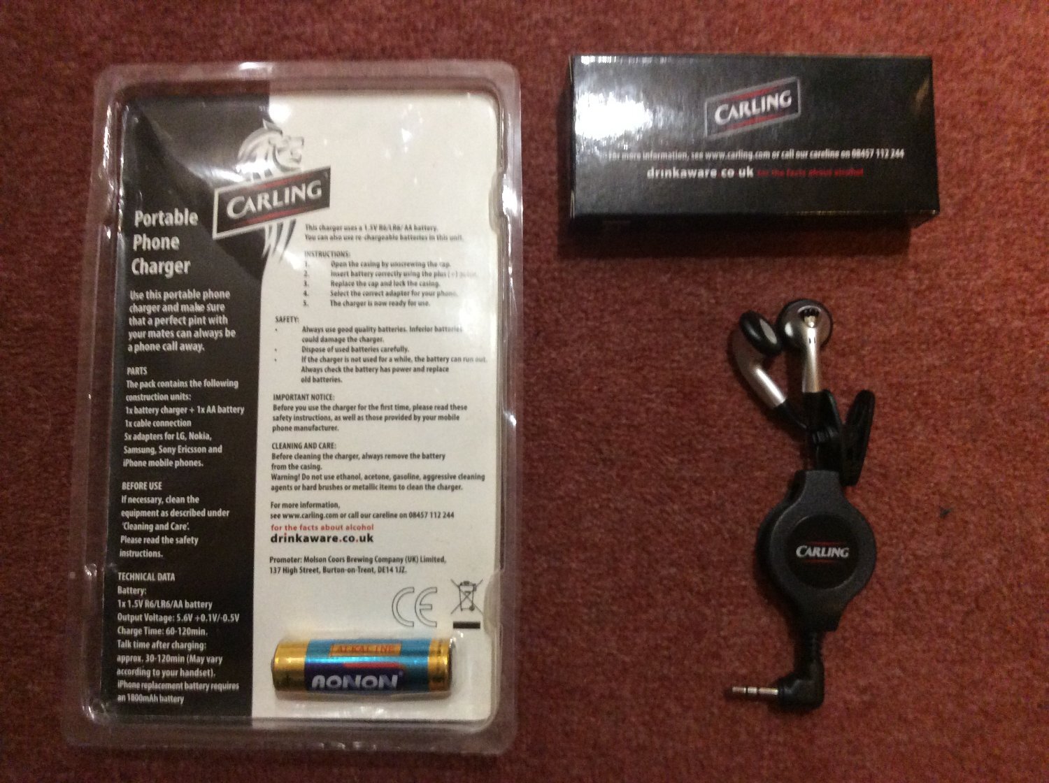 PORTABLE MOBILE PHONE CHARGER AND EARPHONES.