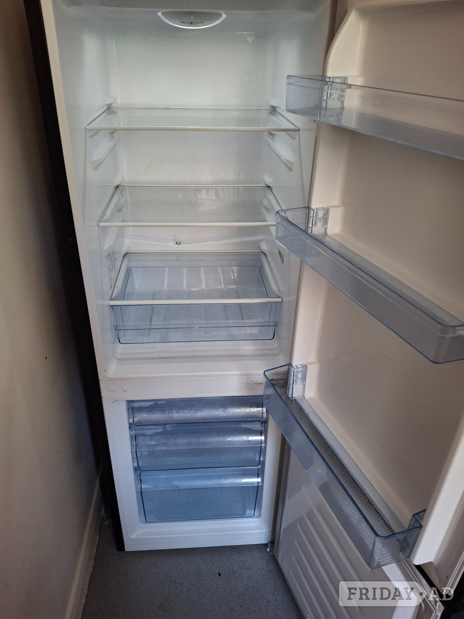 Fridge freezer in black free to collector in Brighton