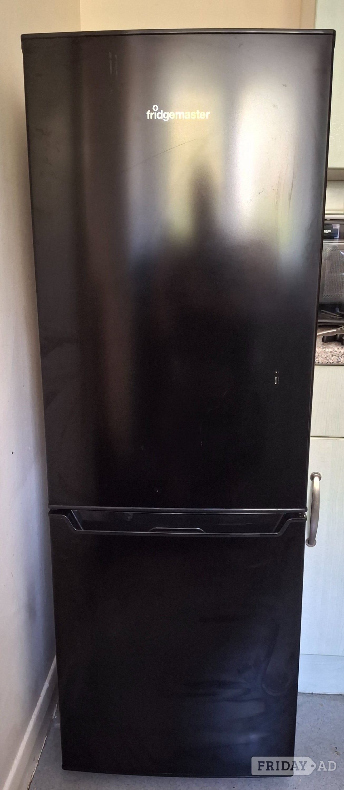 Fridge freezer in black free to collector