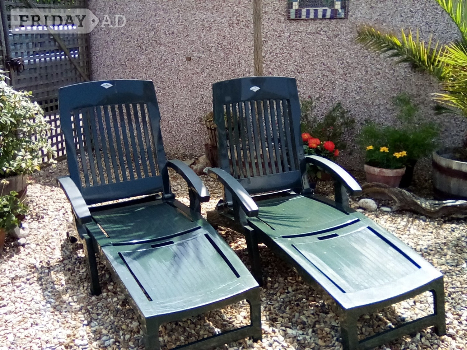 Worthing Two garden sunloungers with matching mattresses. 