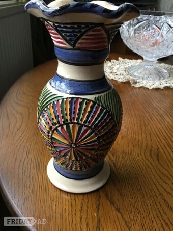 Multi coloured pottery vase with fluted rim and carved effect