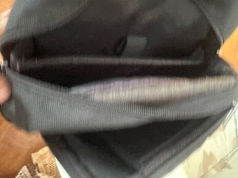 Black laptop bag with multiple zipped pockets