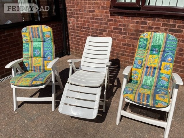 Three White PVC patio chairs, two with cushions plus table in Southampton