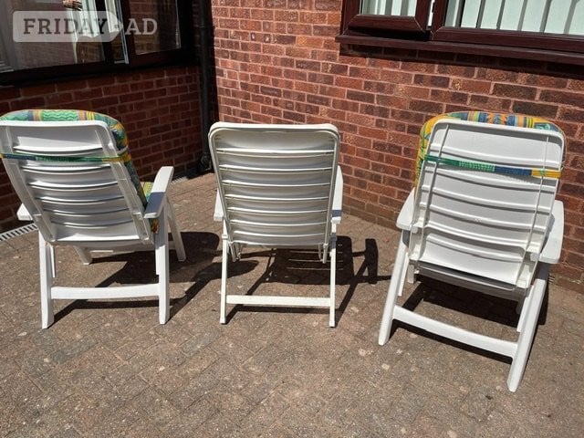 Three White PVC patio chairs, two with cushions plus table - Garden