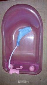 Baby doll bath with dolphin attached shower