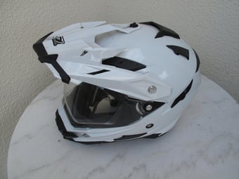 Motorcycle helmet with peak