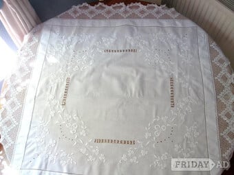 Tablecloth, white embroidered with lace surround.