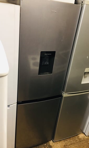 Logik fridge freezer with water dispenser in excellent condition.