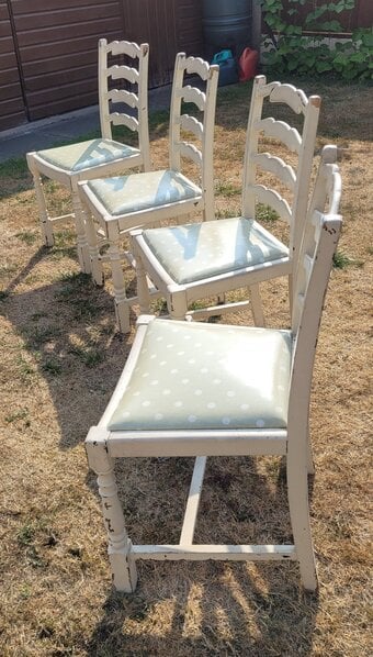 A set of four charming cream wooden dining chairs, 