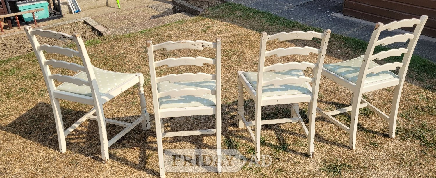 Sittingbourne A set of four charming cream wooden dining chairs, 