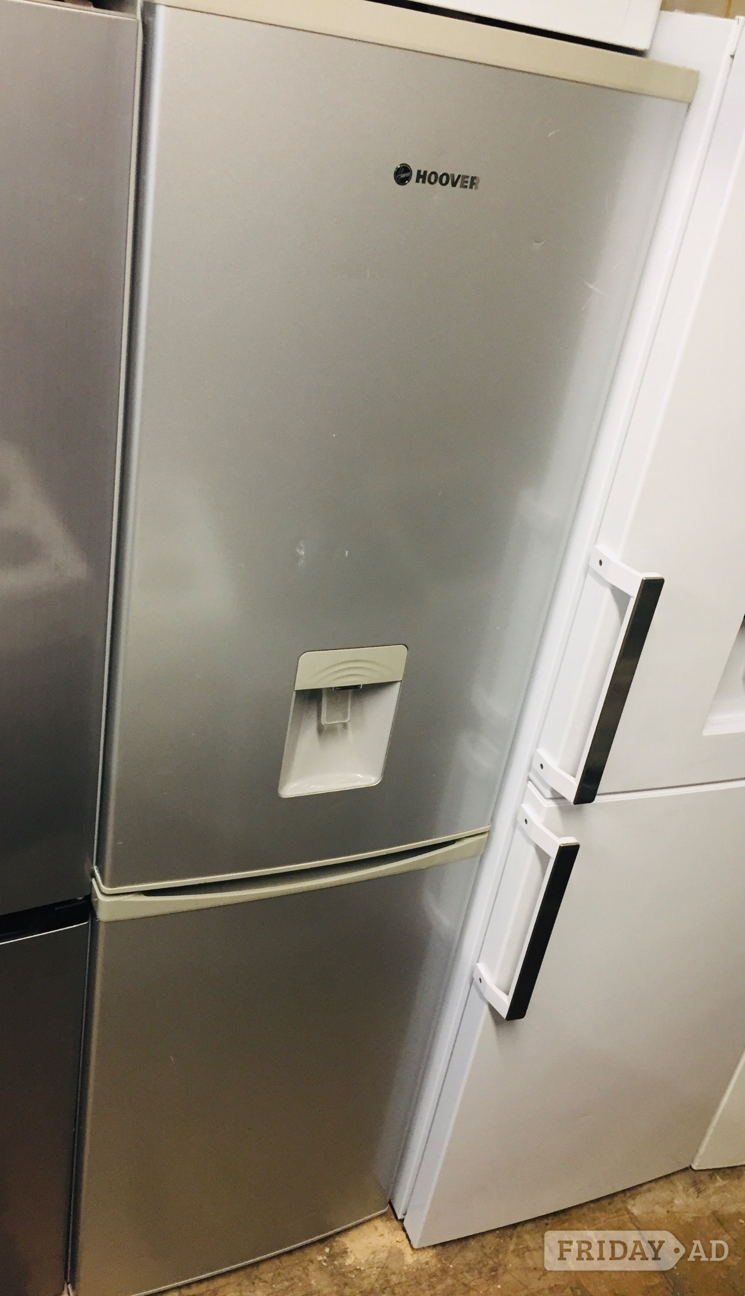 Hoover silver fridge freezer frost free with water dispenser.