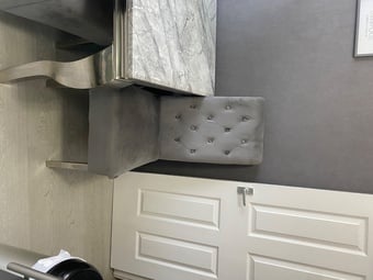 Grey and white marble dining table with 4 chairs and a bench