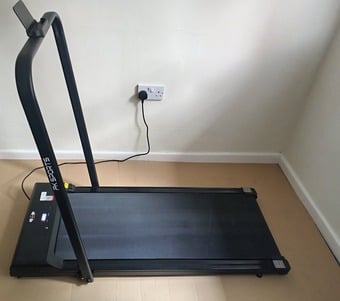 Black Electronic Foldaway walking machine. 