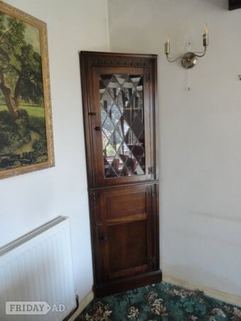 Tall corner display cabinet, dark oak with glazed door