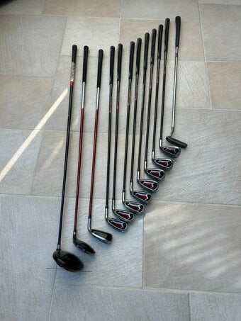 Golf Clubs and Electric Trolley. 