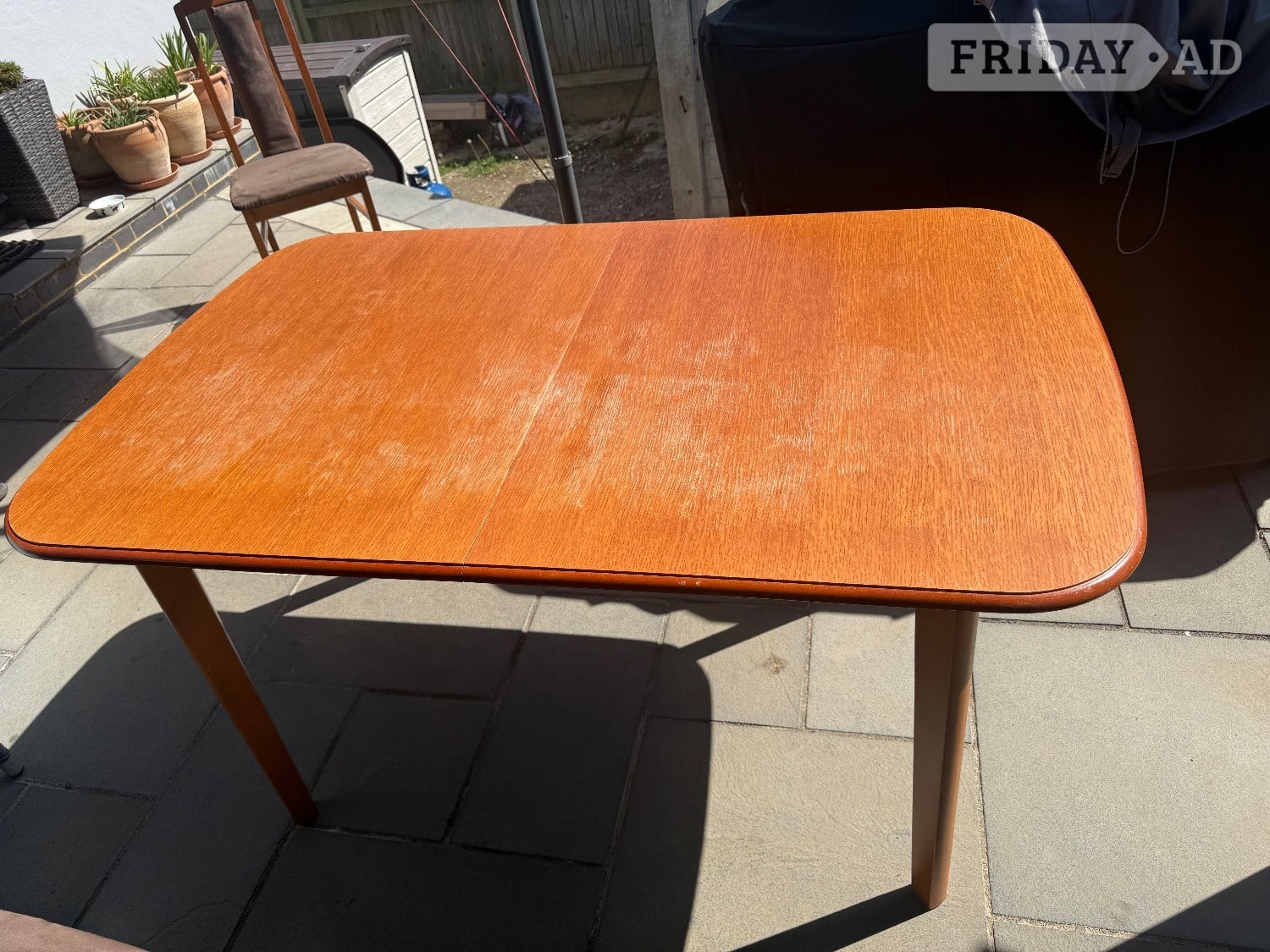 Teak extendable dining table with 6 chairs in Brighton