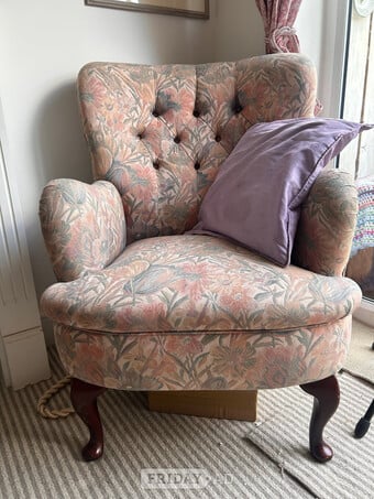 Pretty upholstered arm chair. Well loved fabric but solid frame