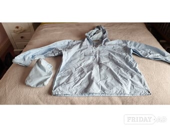 A fold away rain jacket in light blue