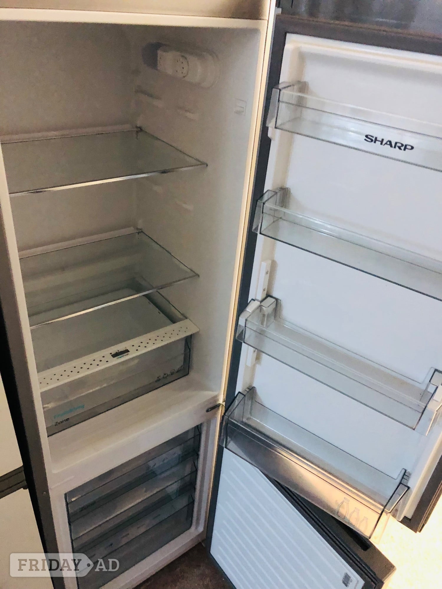 Sharp frost free silver fridge freezer as new .