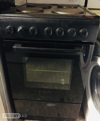 Black solid Top electric cooker 50CM wide with Top oven & grill.