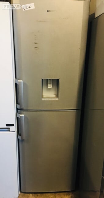 Beko Silver fridge freezer with water dispenser .
