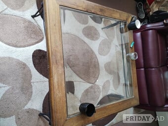 LARGE TUDOR COFFEE TABLE. GLASS TOP RAUGHT IRON LEGS