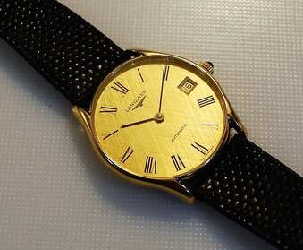 Longines gentlemans 9ct solid gold wristwatch.