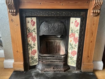 CAST IRON FIRE PLACE WITH PINE SURROUND