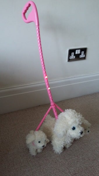 Animagic dog and pups attached on a lead good condition.