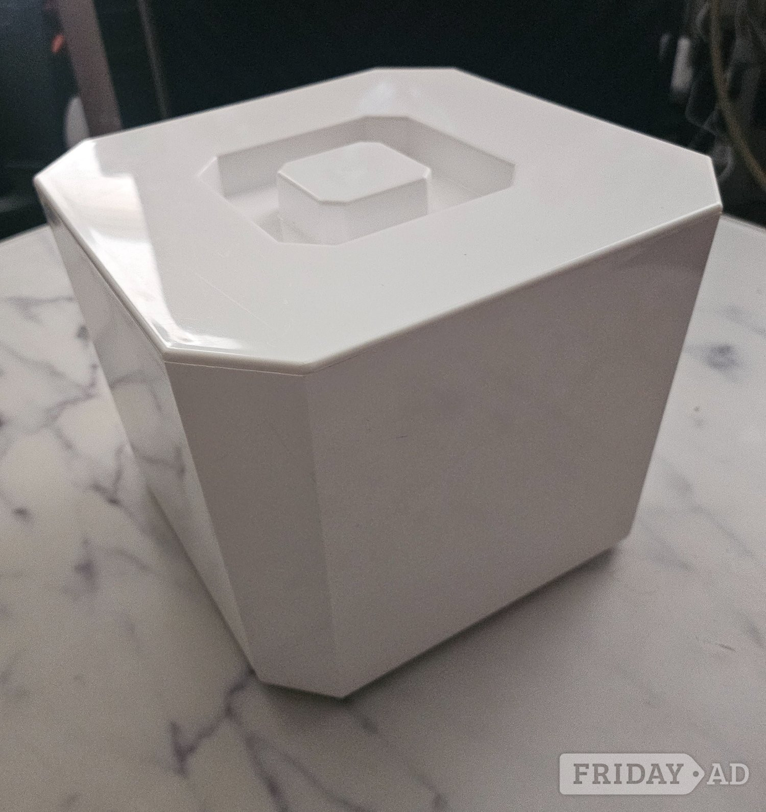 White plastic ice bucket.