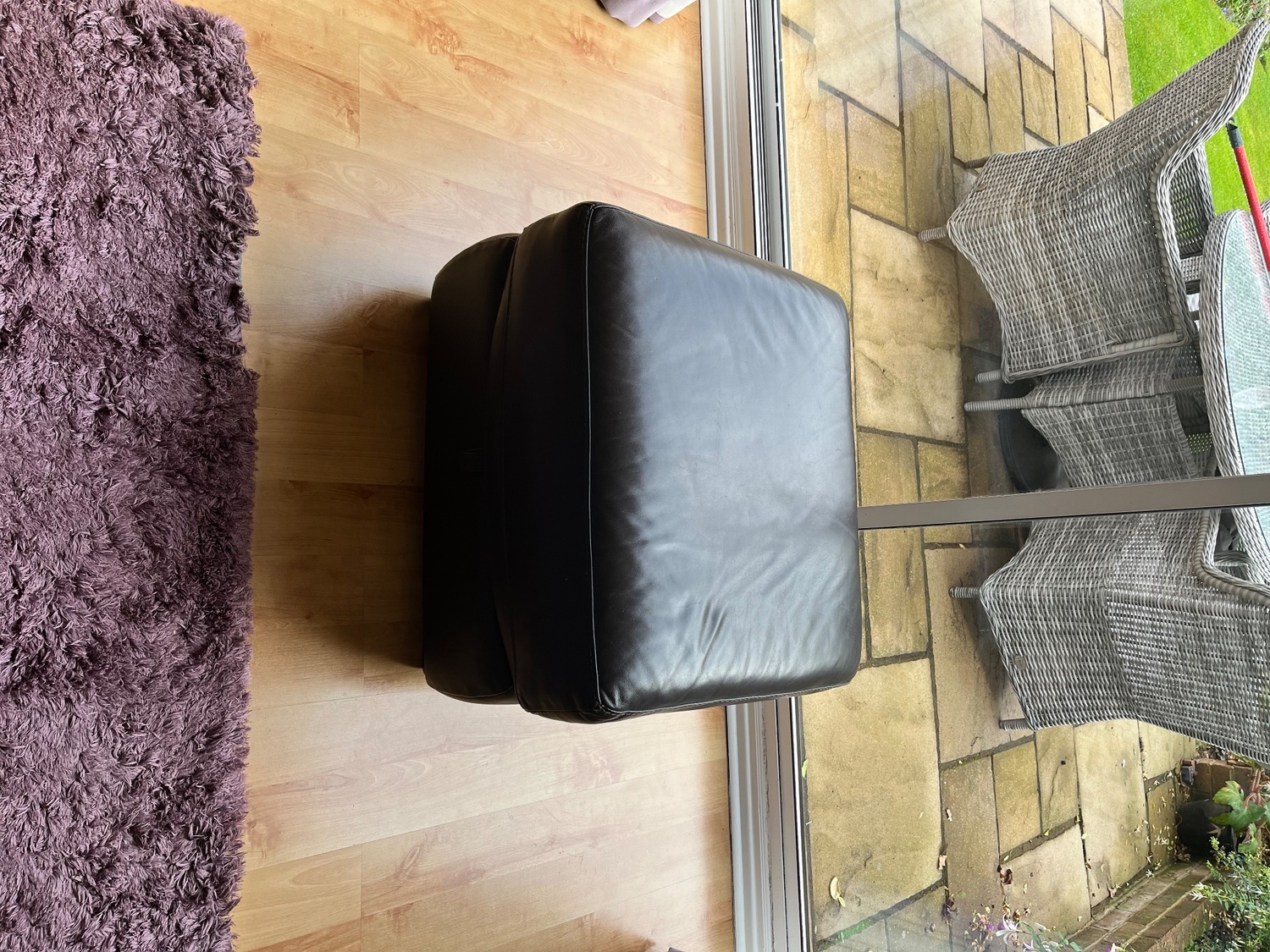 Two, two seater leather sofas plus storage footstall